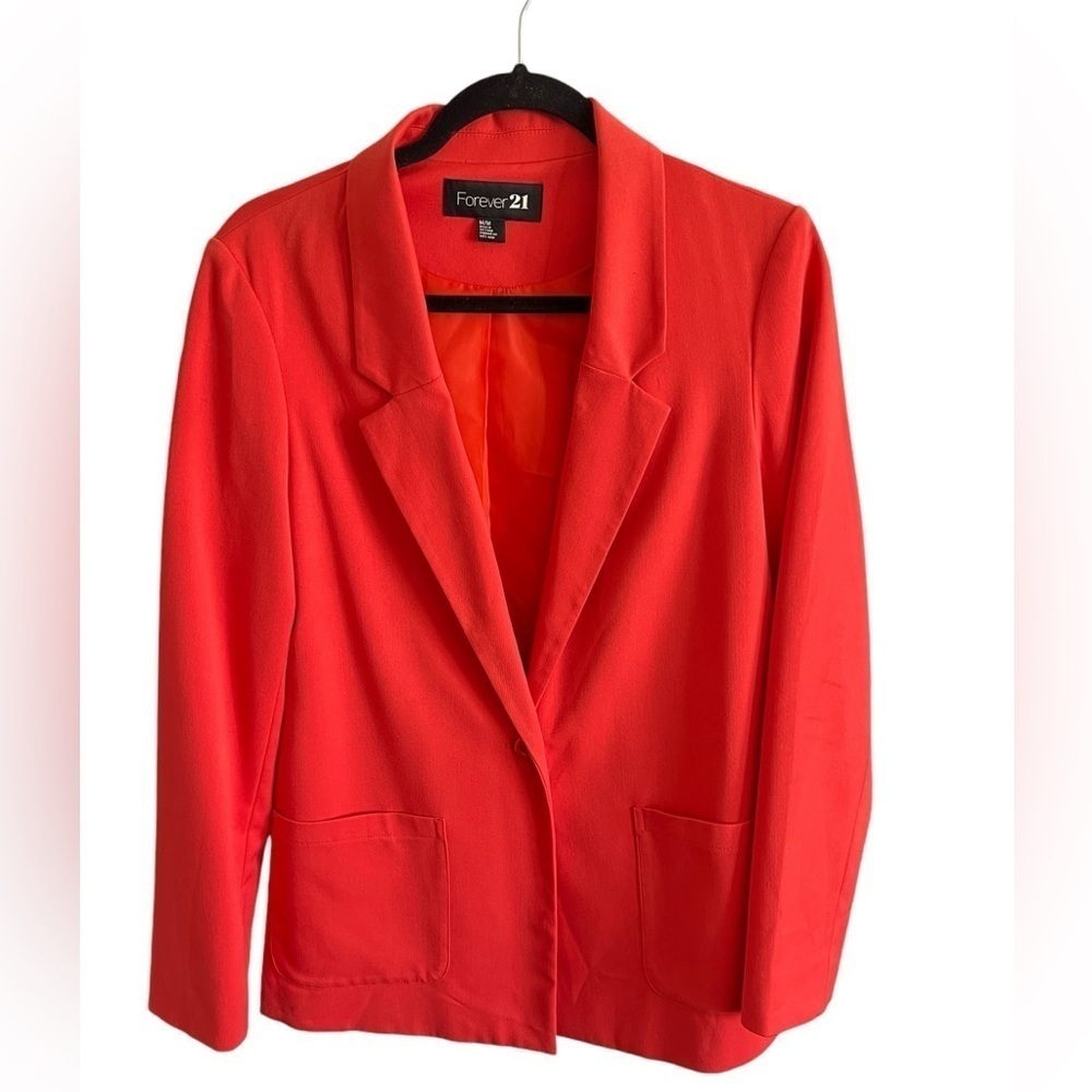 Bright orange blazer with pockets